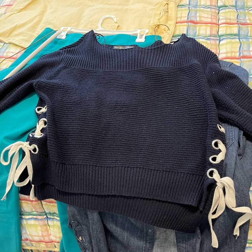 Boat neck sweater with tie sleeves